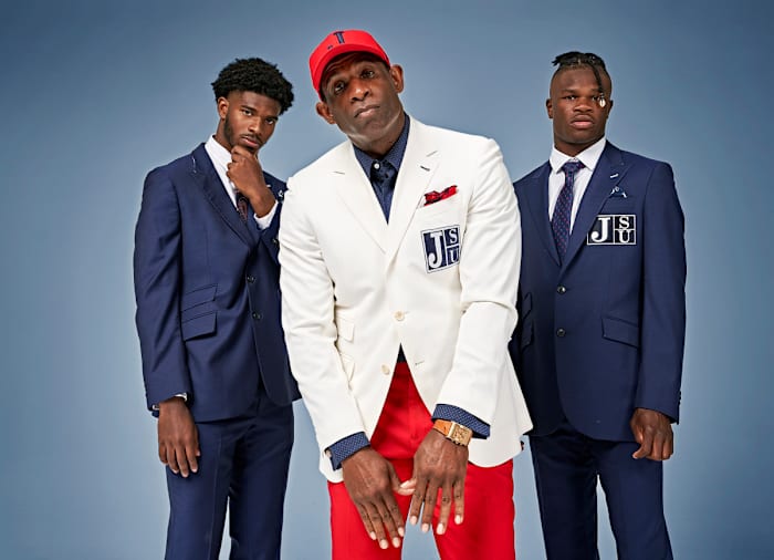 Jackson State coach Deion Sanders poses with players Shadeur Sanders and Travis Hunter